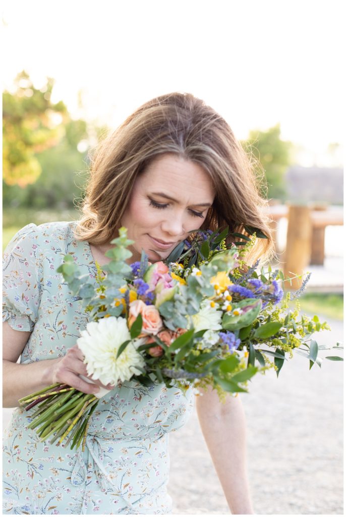 Woman smells a bouquet of flowers