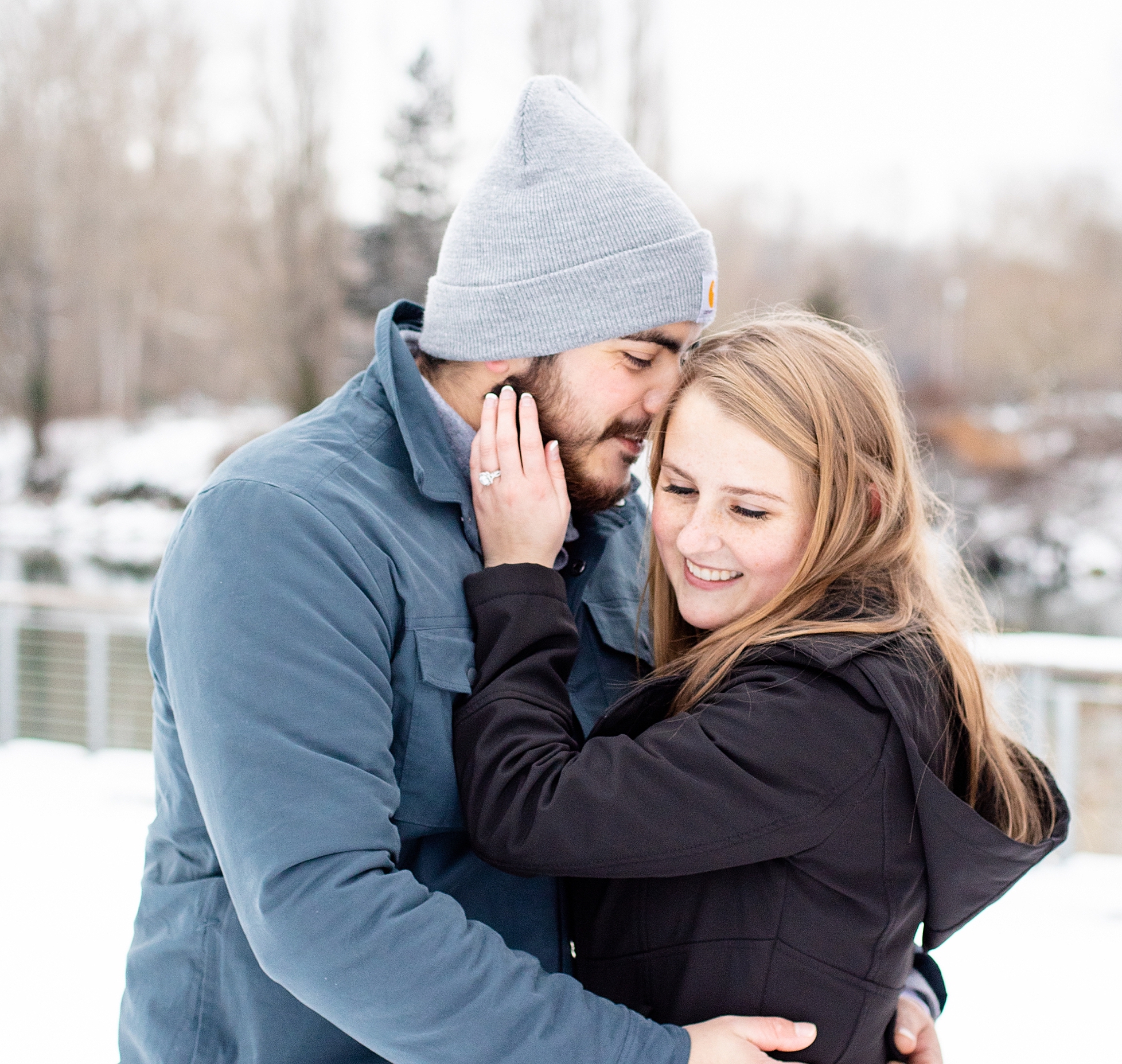couple in the snow for winter engagement photos