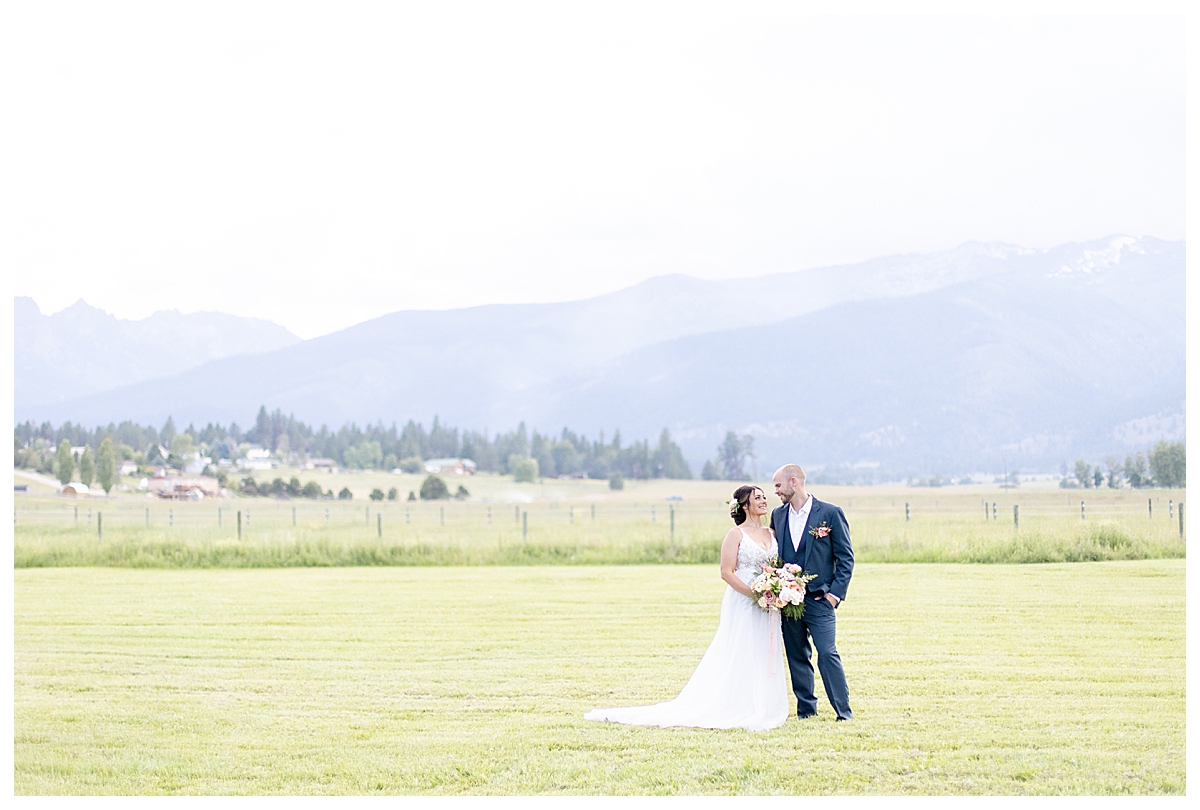 Bitterroot Valley wedding at Homestead on McVey in Victor, Montana with couple in front of mountains