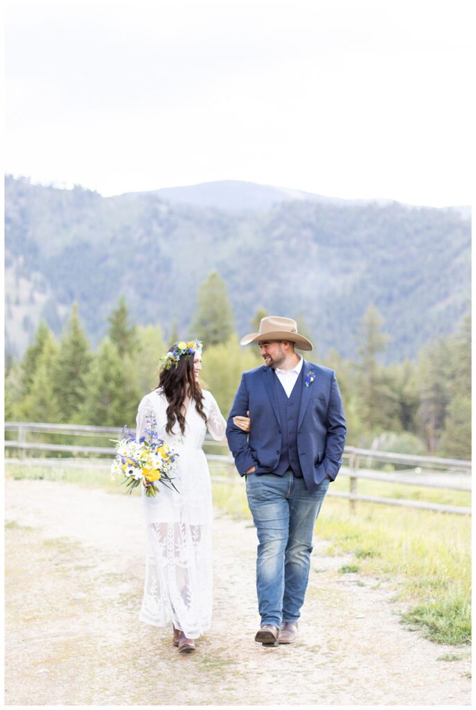 Couple walks at ranch for Montana luxury ranch elopement 