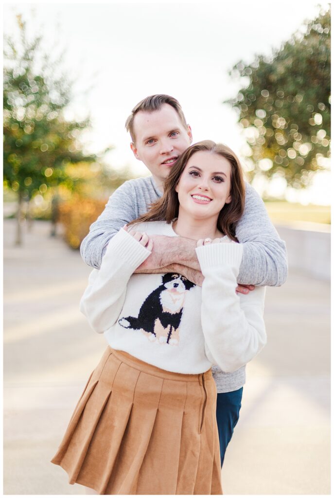 Couple hugging at park in Knoxville Tennessee for engagement photos