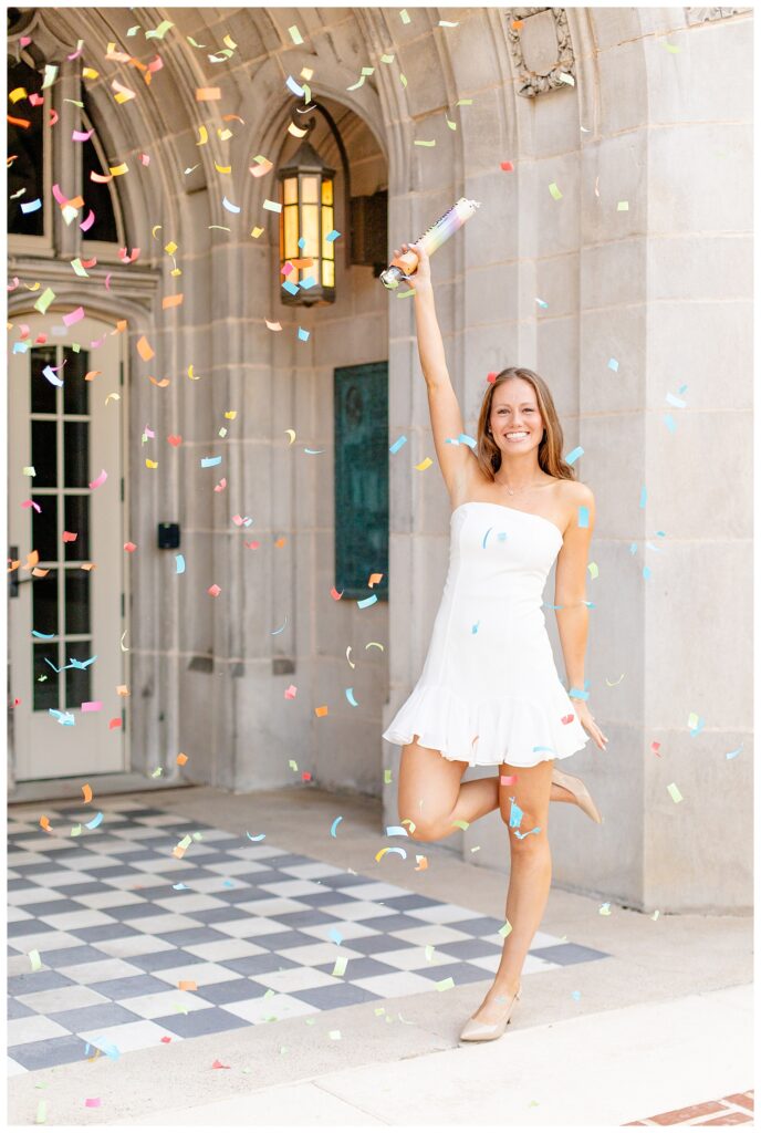 College grad surrounded by confetti for University of Tennessee graduation photos with Katherine Schot Photography