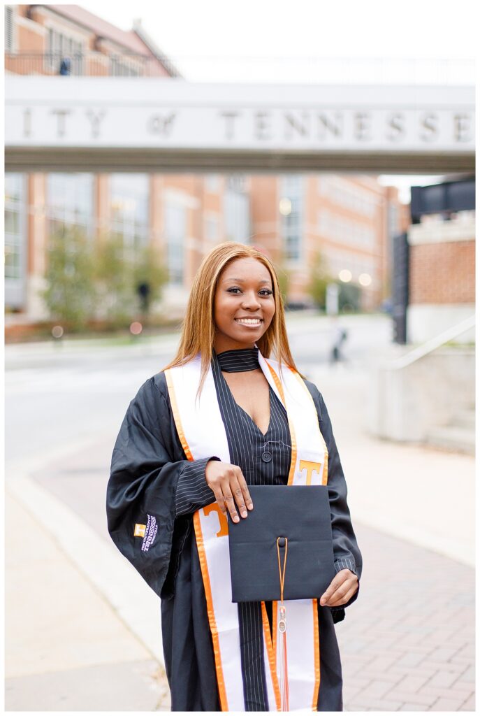 University of Tennessee graduation photo next to bridge
