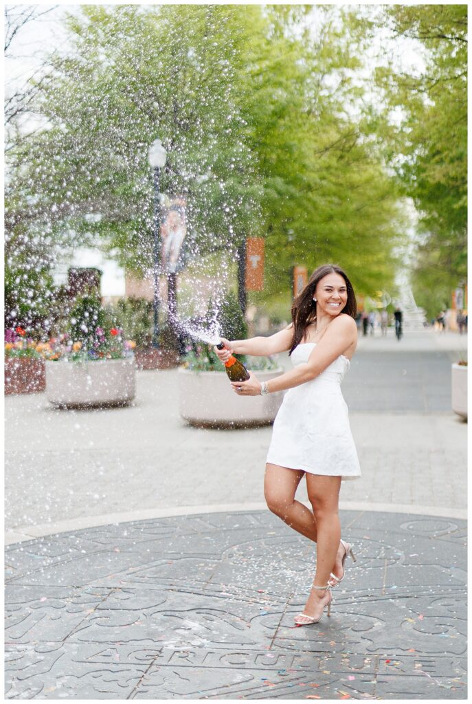 University of Tennessee Grad Photo Locations The Seal with grad popping champagne
